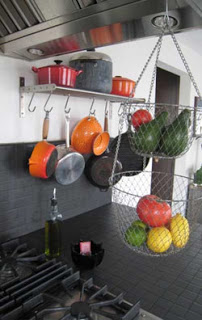 pots and pans hanging on the wall