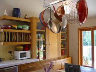 pots and pans hanging on the ceiling