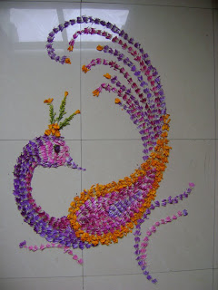 peacock rangoli made by fresh flower