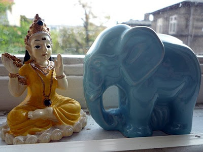 a blue elephant on window sill