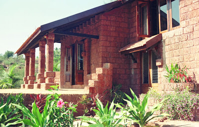 The house is constructed from the local laterite stone