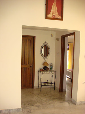 A wrought iron corner in the passage and picture of lady Fatima hangs over the entrance to the bedroom