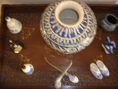 a close-up bell and blue pottery collection