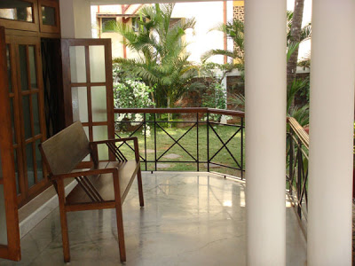 An old wooden bench in the verandah