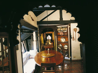 Kuthu Muth's kitchen - fine quality wood carving with traditional brass plates and bowls