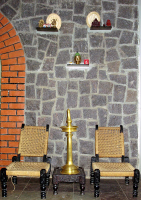 The brass artifacts and traditional furniture bring in the Indian touch