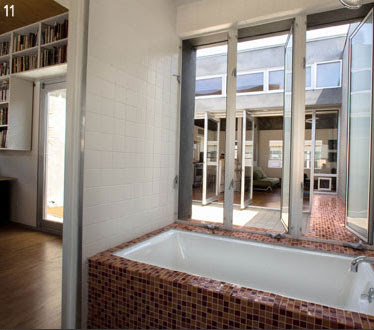 The master bath takes maximum advantage of the courtyard to provide an indoor outdoor bathing space