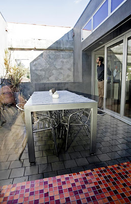 The marble-topped dining table is designed by Ali