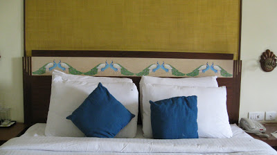 peacock theme at the headboard of the bed