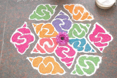 the beautiful rangoli decorated in front gate