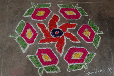 Colored saw dust is used in this rangoli