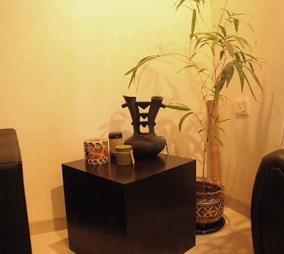 Cube side-table, candles, the bamboo plant and a bamboo rain maker and a gurgling mini waterfall