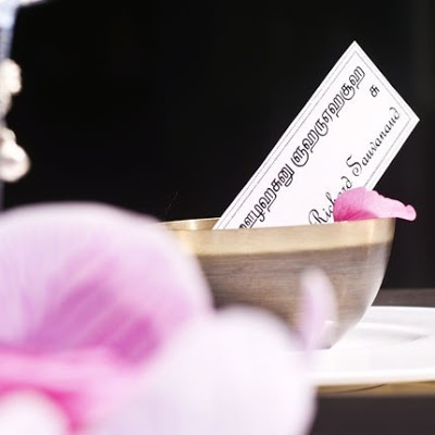 The mixed table ware and Indian font dinner name cards idea