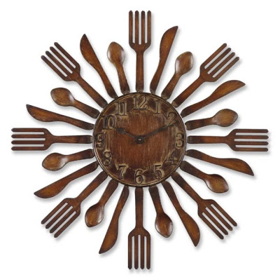 cutlery wall clock hanging at the wall