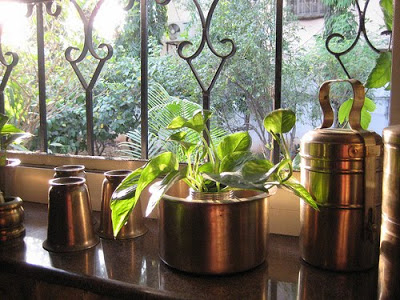 brassware on kitchen shelf