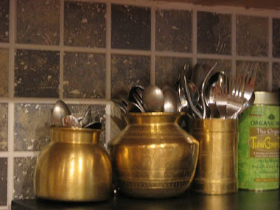 brassware on kitchen shelf