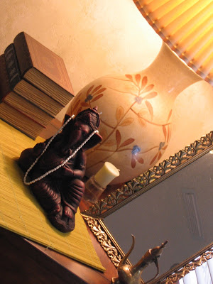 Ganesha with lamp and books at the entryway corner