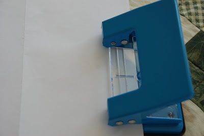 a stencil with a paper puncher