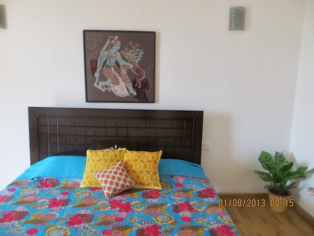 Artwork frame hang over the master bedroom wall | Aparna's home tour in Bengaluru