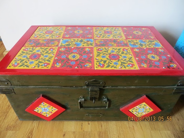 The aluminium trunk converted to a bedside table with handmade tiles on the top and sides | Aparna's home tour in Bengaluru