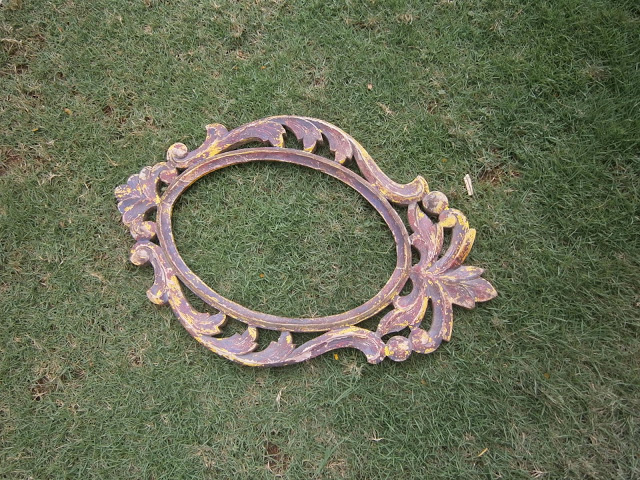 a lovely old Chippendale-style wooden mirror frame