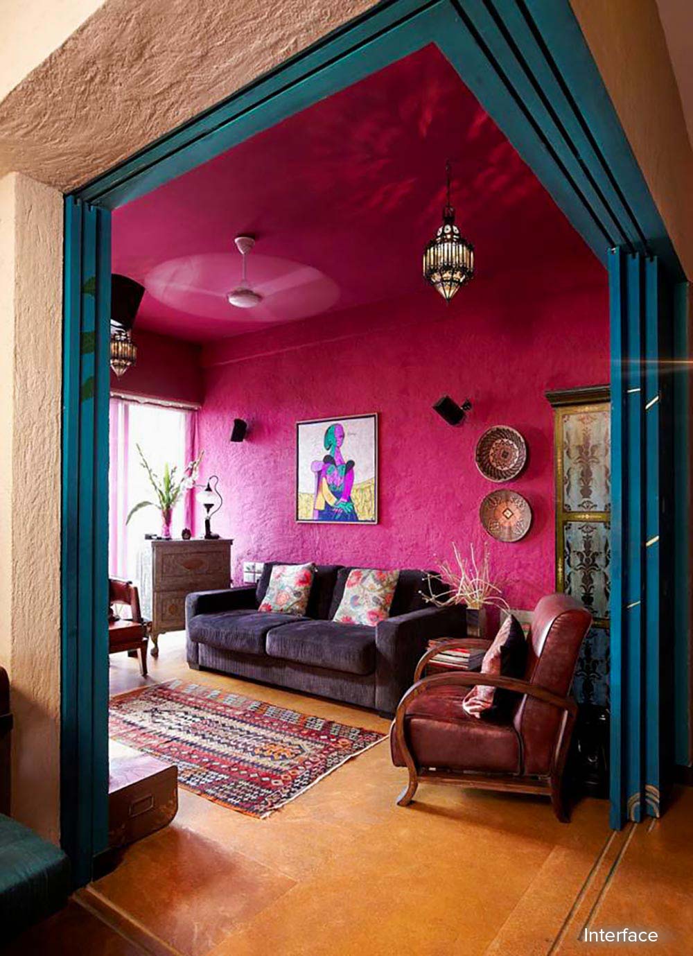 A gorgeous Rani pink wall at a living room | Mumbai Home Tour in its Turkish Influences