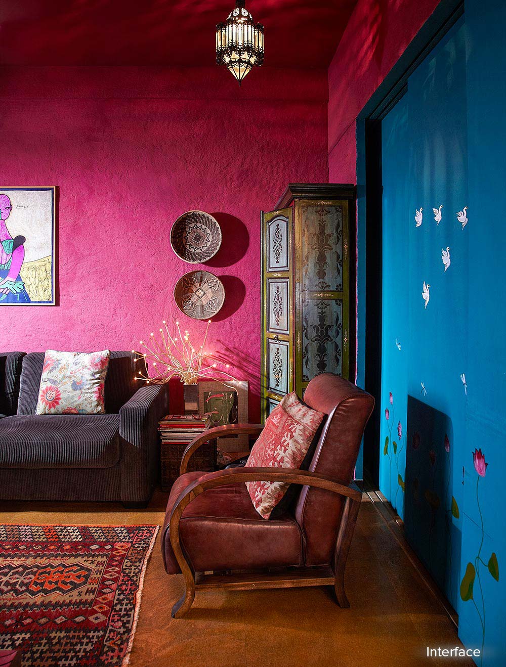 A gorgeous Rani pink wall at a living room | Mumbai Home Tour in its Turkish Influences