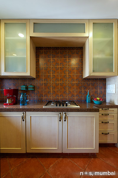 The patterned dado tiles on the on the kitchen backsplash