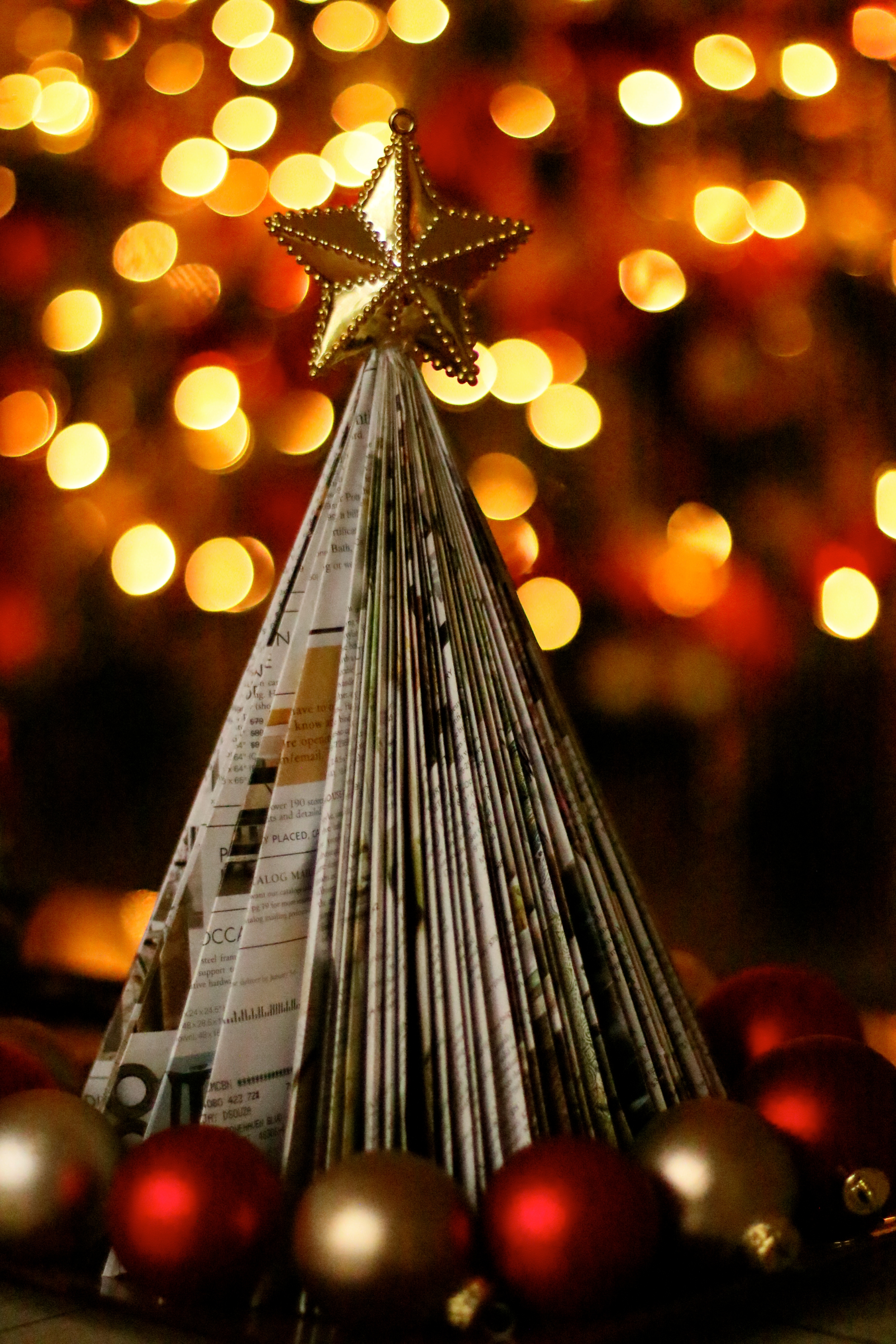 a folded paper tree made out of a Pottery Barn catalog | Meera and Vijay's Christmas home Decor