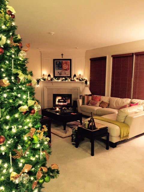 The family living room has been decorated with christmas tree, and it gives the room a warm, cozy feel | Meera and Vijay's Christmas home Decor