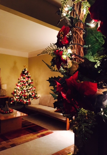 The living room at the front of the house is decked up in red and gold | Meera and Vijay's Christmas home Decor