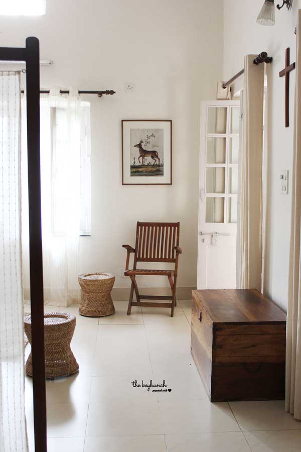 The framed picture of a deer grudgingly allows some colour into the room, and teamed with the wooden accents