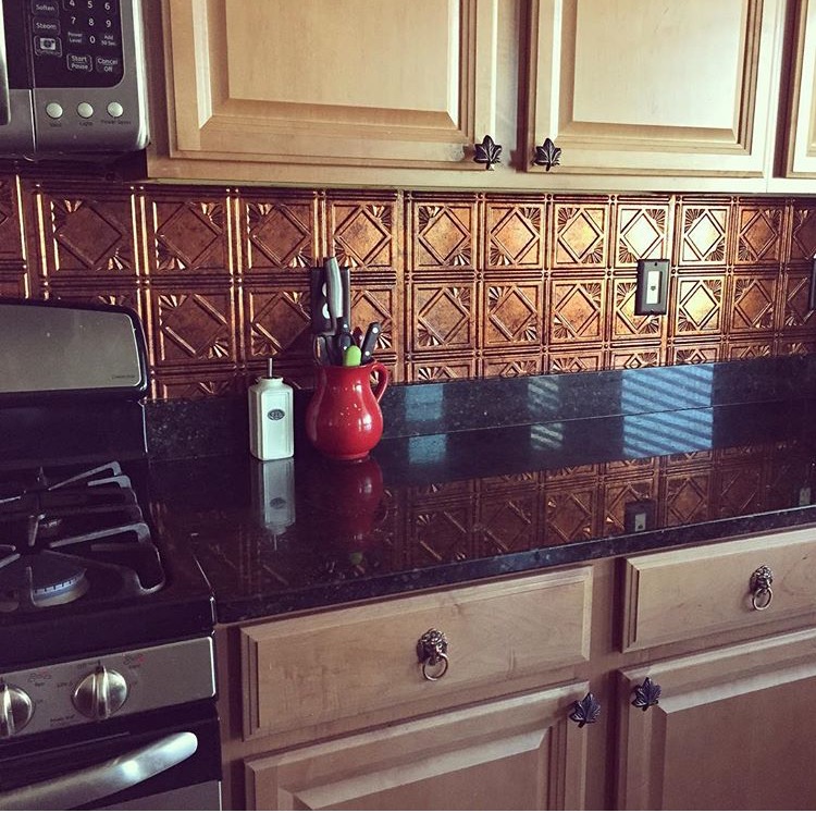 a metal backsplash in a copper tone in kitchen | Ethnic-Global Style home in Arizona