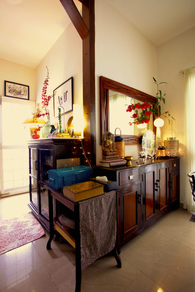 The buffet console has been re-purposed from school cupboards and benches and finished with a dual tone stain on teak | Sujatha and Bharath's Apartment decor - Home tour