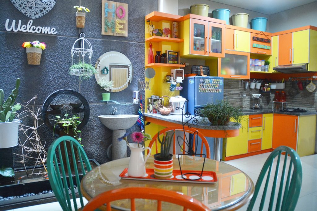 The bright colours and the quirky décor dining room and kitchen | Inda and Sony Sulaksono's Colorful Home tour