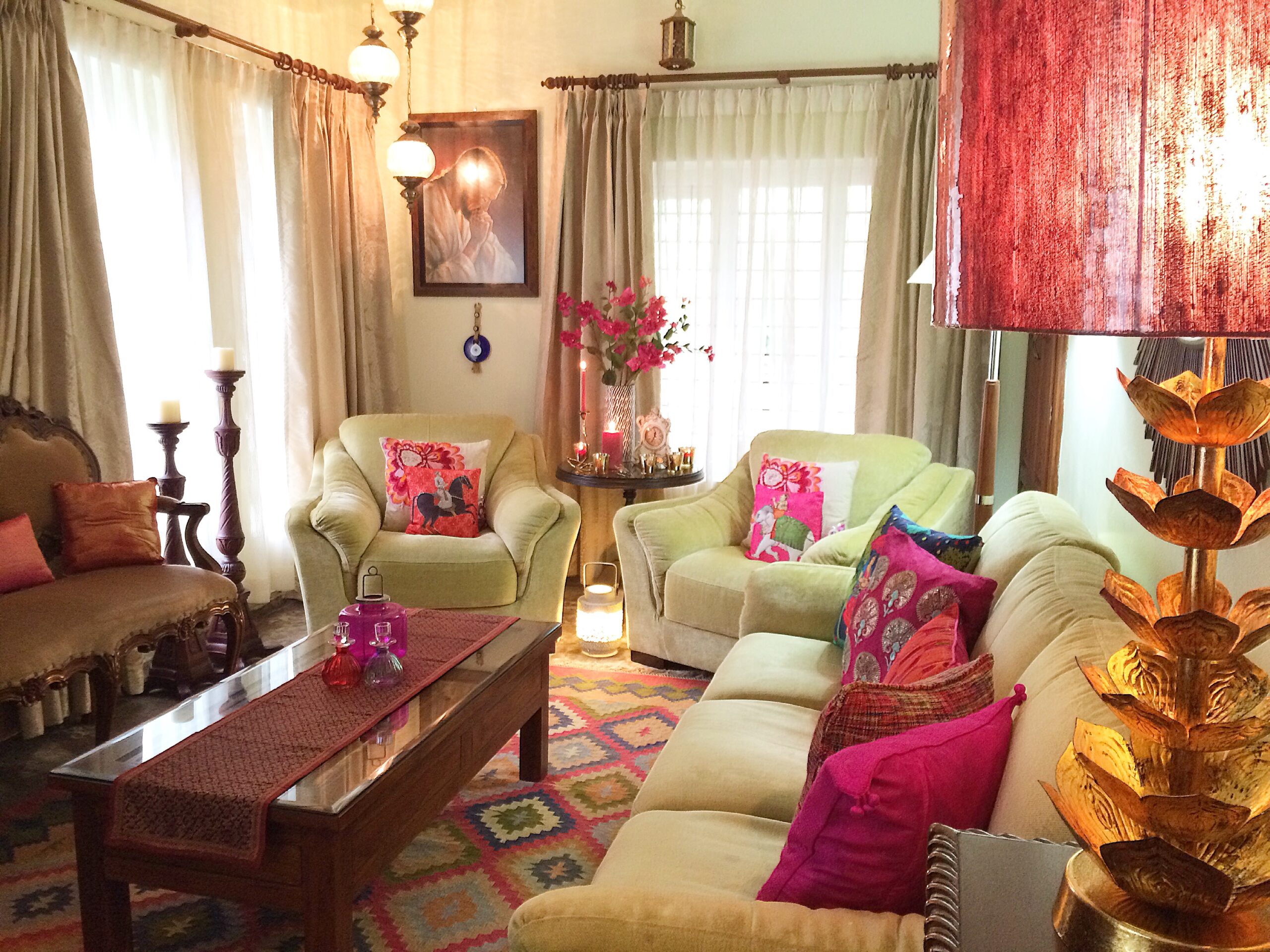 Pink living room with beautiful corner lamps, lamp shade, candles and lanterns placed throughout this room | Joseph home tour