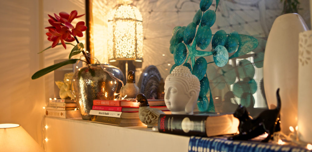 a wall converted into a niche with toughened glass to allow the space to breathe more | Sujatha and Bharath's Apartment decor - Home tour