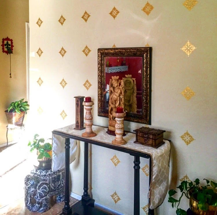 The foyer wall with gold stencils | Ethnic-Global Style home in Arizona