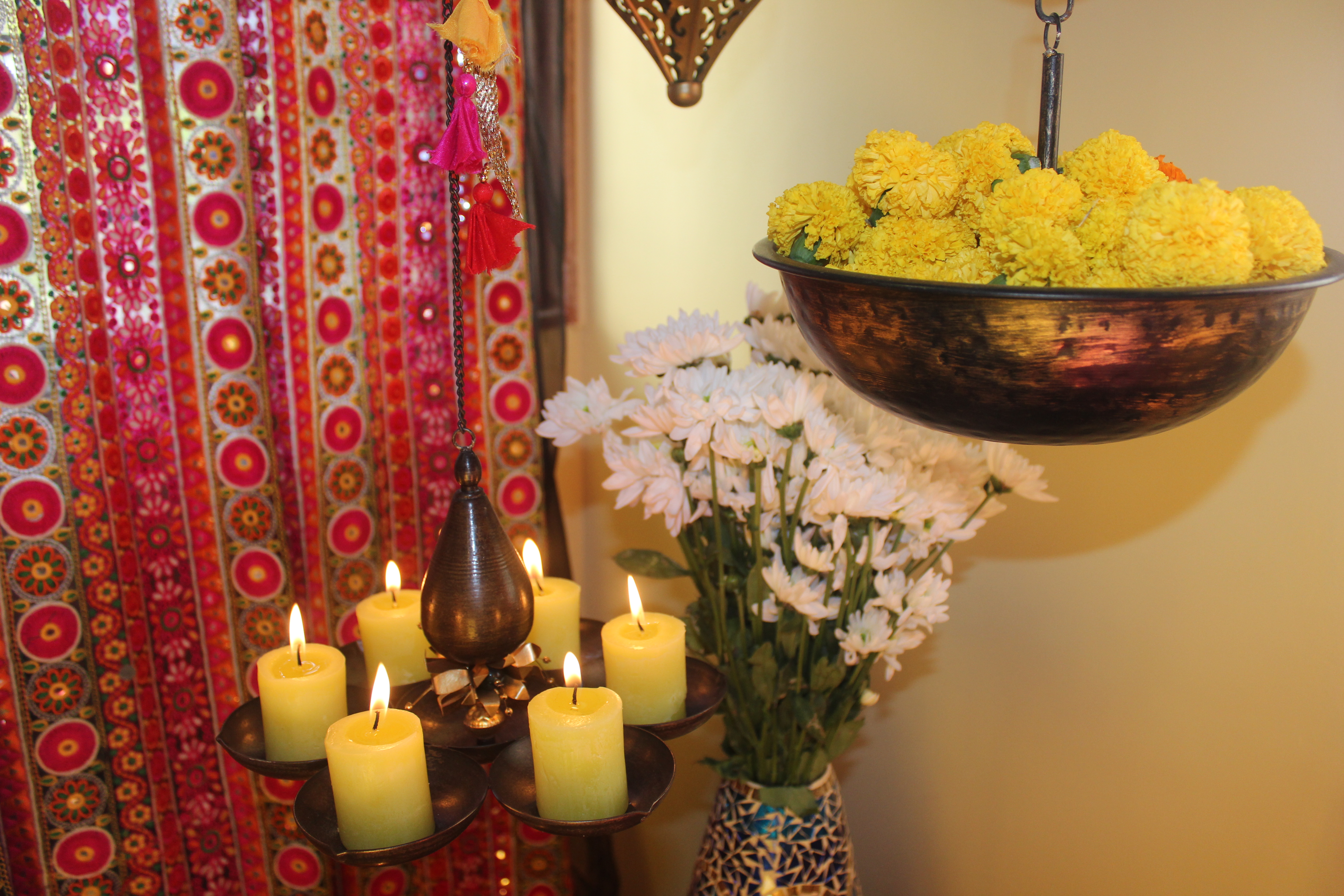 Brass diya and urli at the corner of the living room | Color and dramatic at Bembem's Pune Home