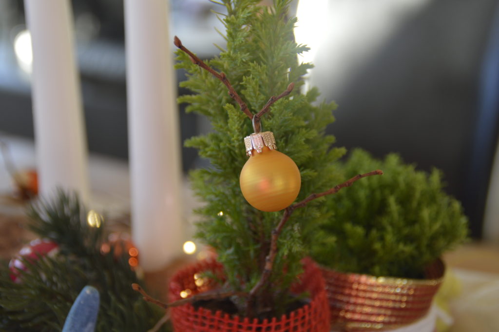 wooden candle stand with christmas decor