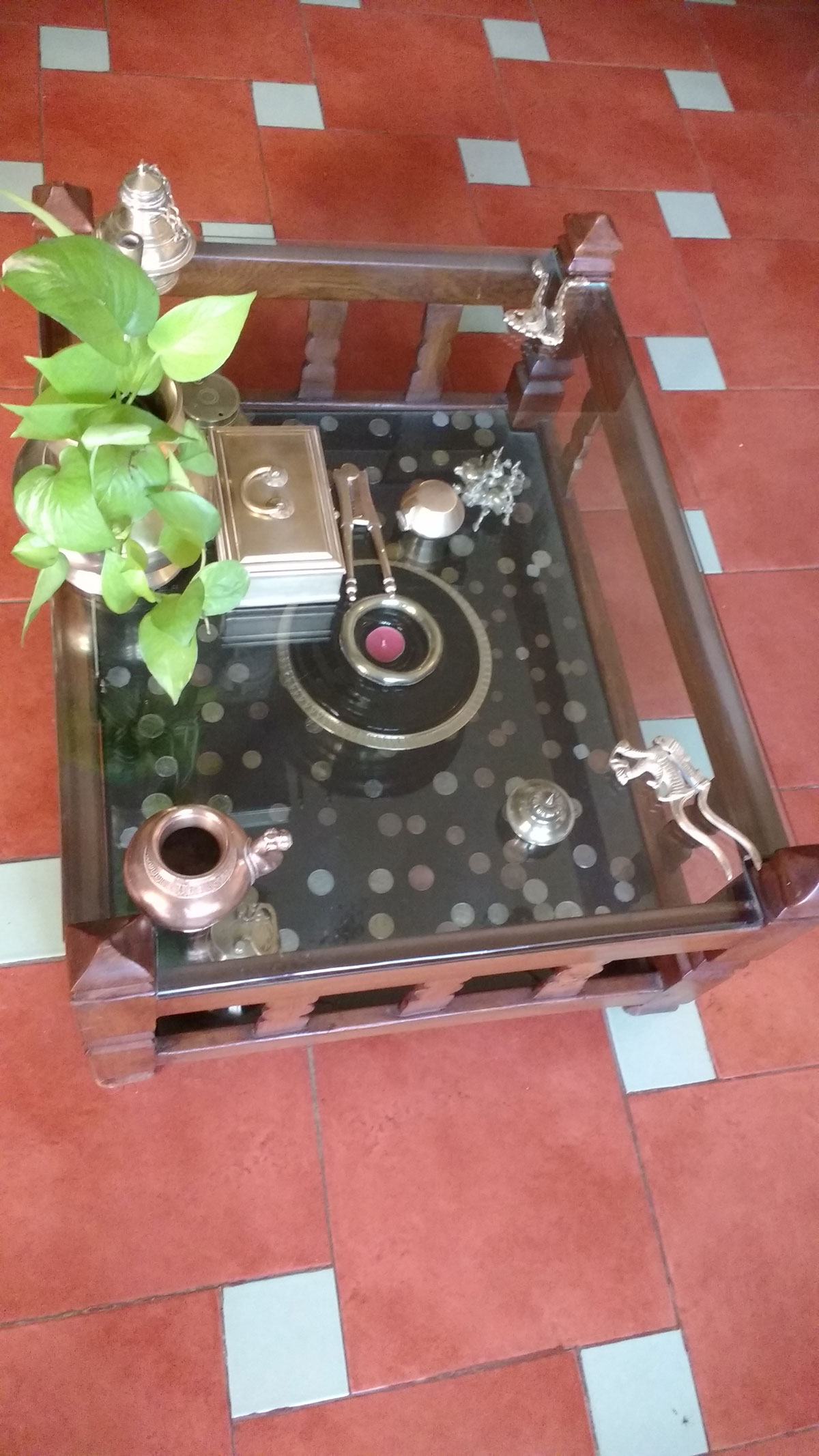 a glass-topped center table at the living room