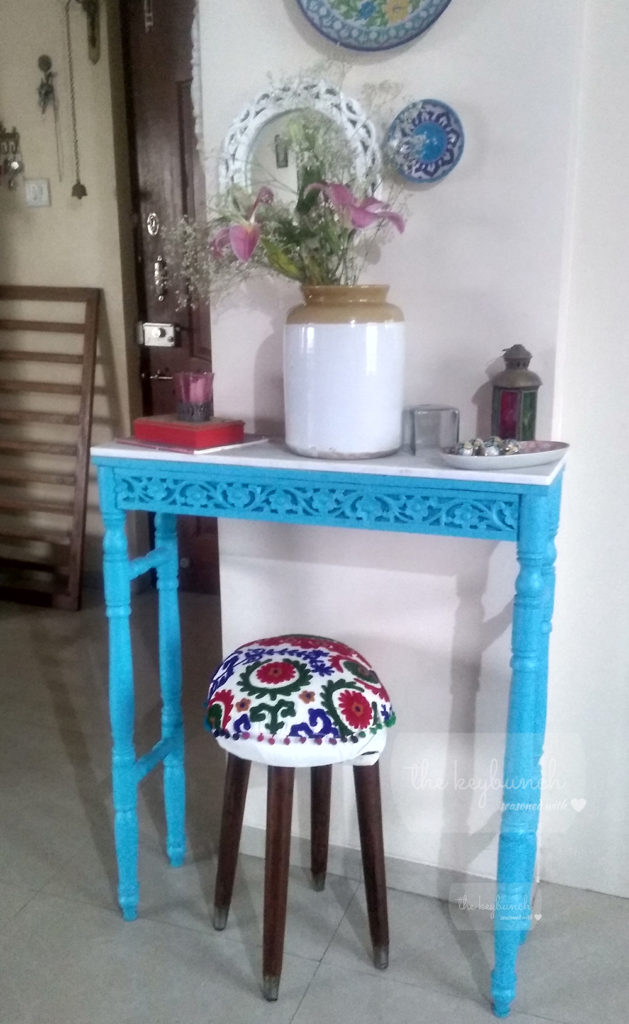 makeover stool under marble-topped refurbished table