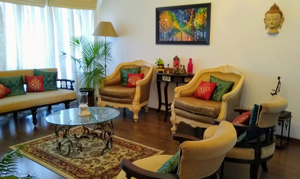 Jayashree Rajan's garden apartment tour on The Keybunch: The cream colored big chairs in the living room