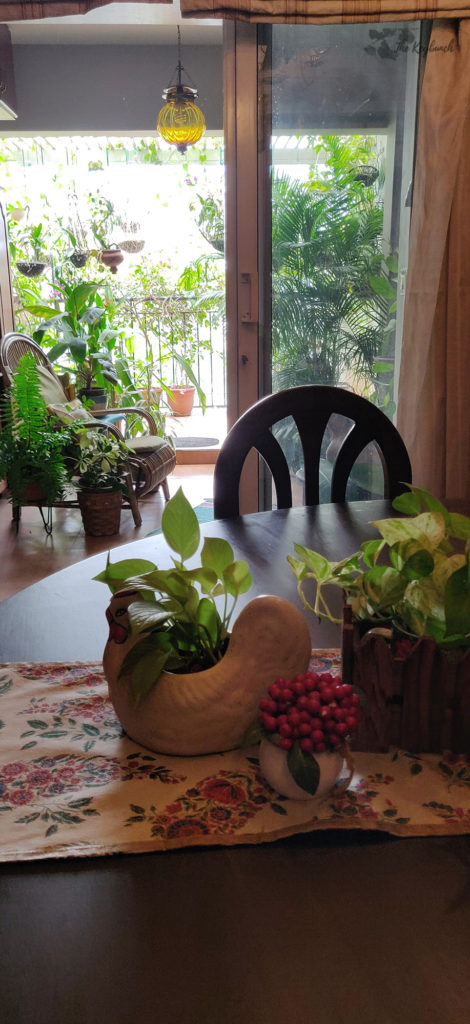 Jayashree Rajan's garden apartment tour on The Keybunch: green balcony with rattan chair