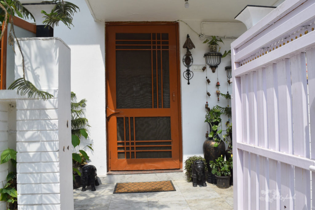 Home decor Tour by Ankita and Sitanshu’s in Lucknow - Green plants at the door entrance