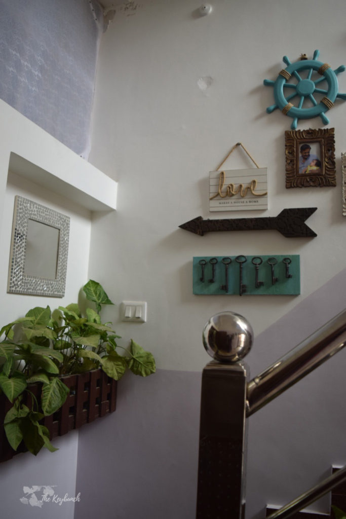 Home decor Tour by Ankita and Sitanshu’s in Lucknow - The stairway decorated with green plants and gallery wall