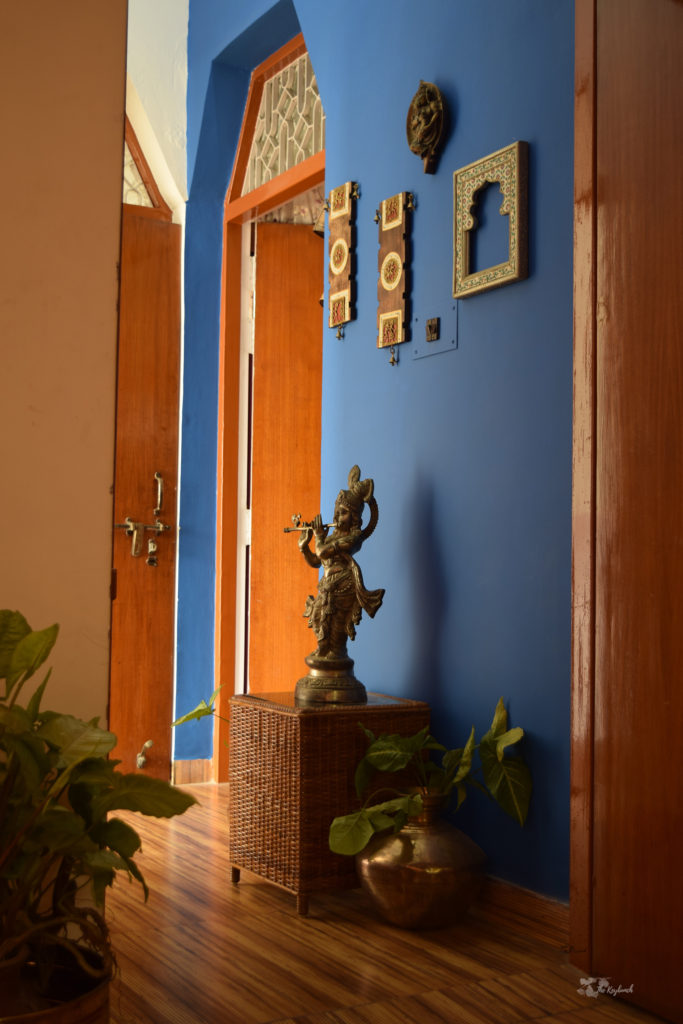 Home decor Tour by Ankita and Sitanshu’s in Lucknow - cerulean wall with brass collection and wall gallery