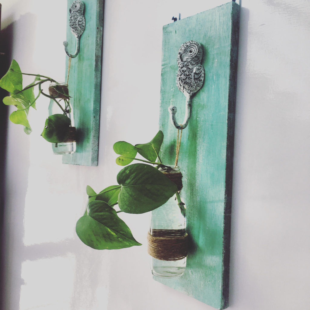 Home decor Tour by Ankita and Sitanshu’s in Lucknow - the entryway decorated with bottles hanged on piece of wood