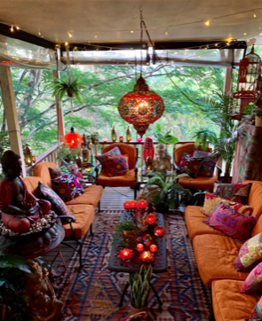 The orange lamp shades are made of glass beads and compliment the orange lounge | Martine's boho chic abode in Australia