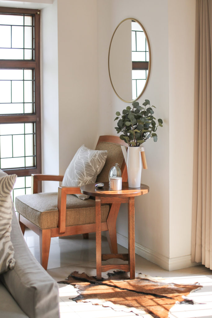 Home Tour with Kaho of Chuzai Living - the entryway room filled with green plants, chair and mirrow frame